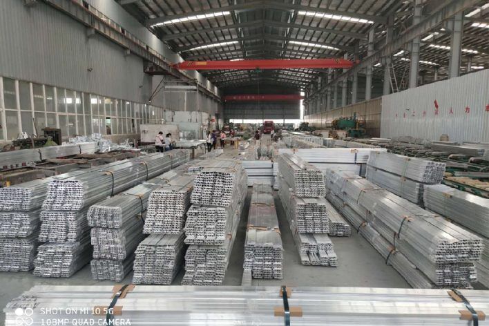 Bundled 6063 aluminum sign channel profiles in the LUYA ALUMINUM extrusion workshop