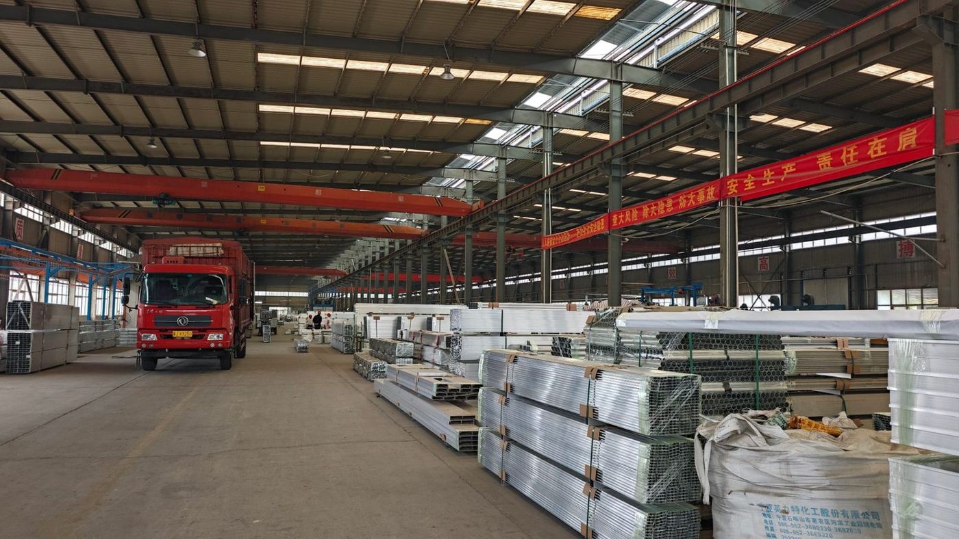 Crated aluminum sheet and profile bundles at the loading bay